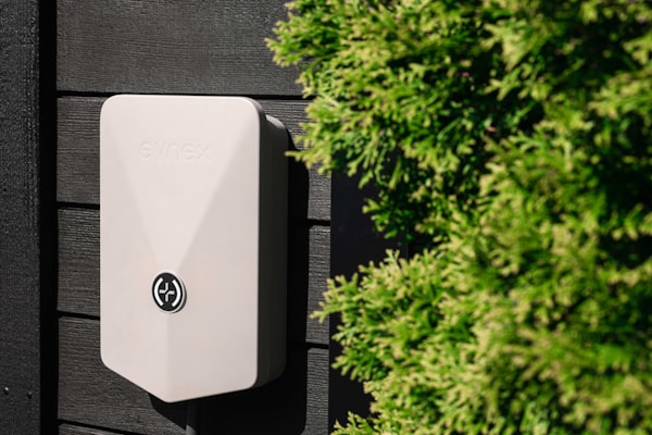 Residential EV charger installed on home exterior wall